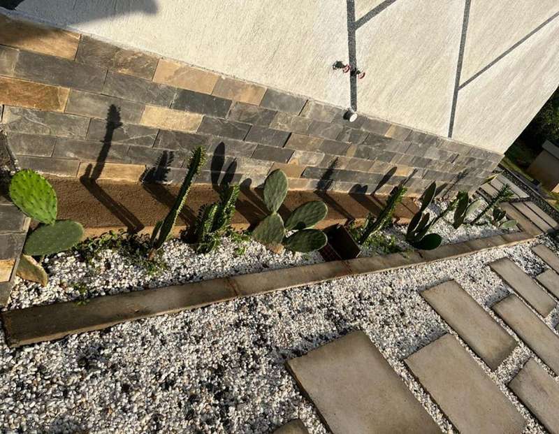 Succulent border along a stone plinth
