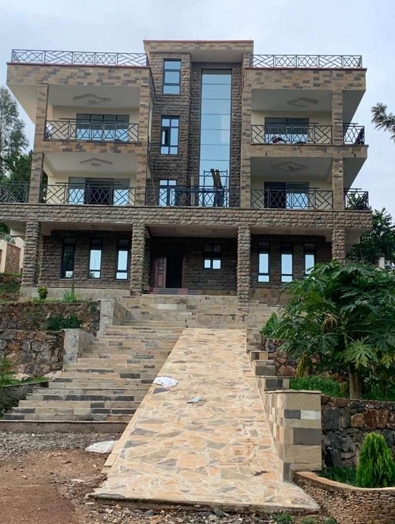 Stone-clad residence with landscaped approach steps, Kisumu